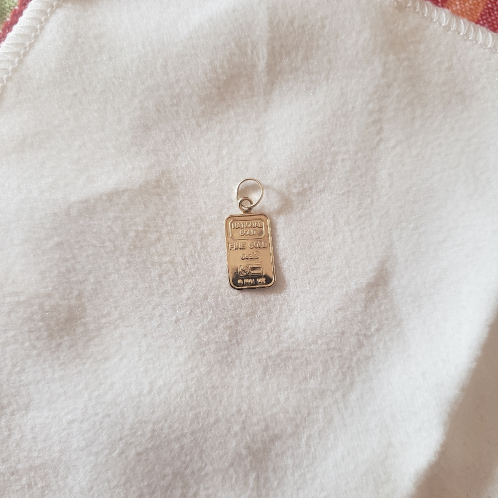 14K gold pendant.